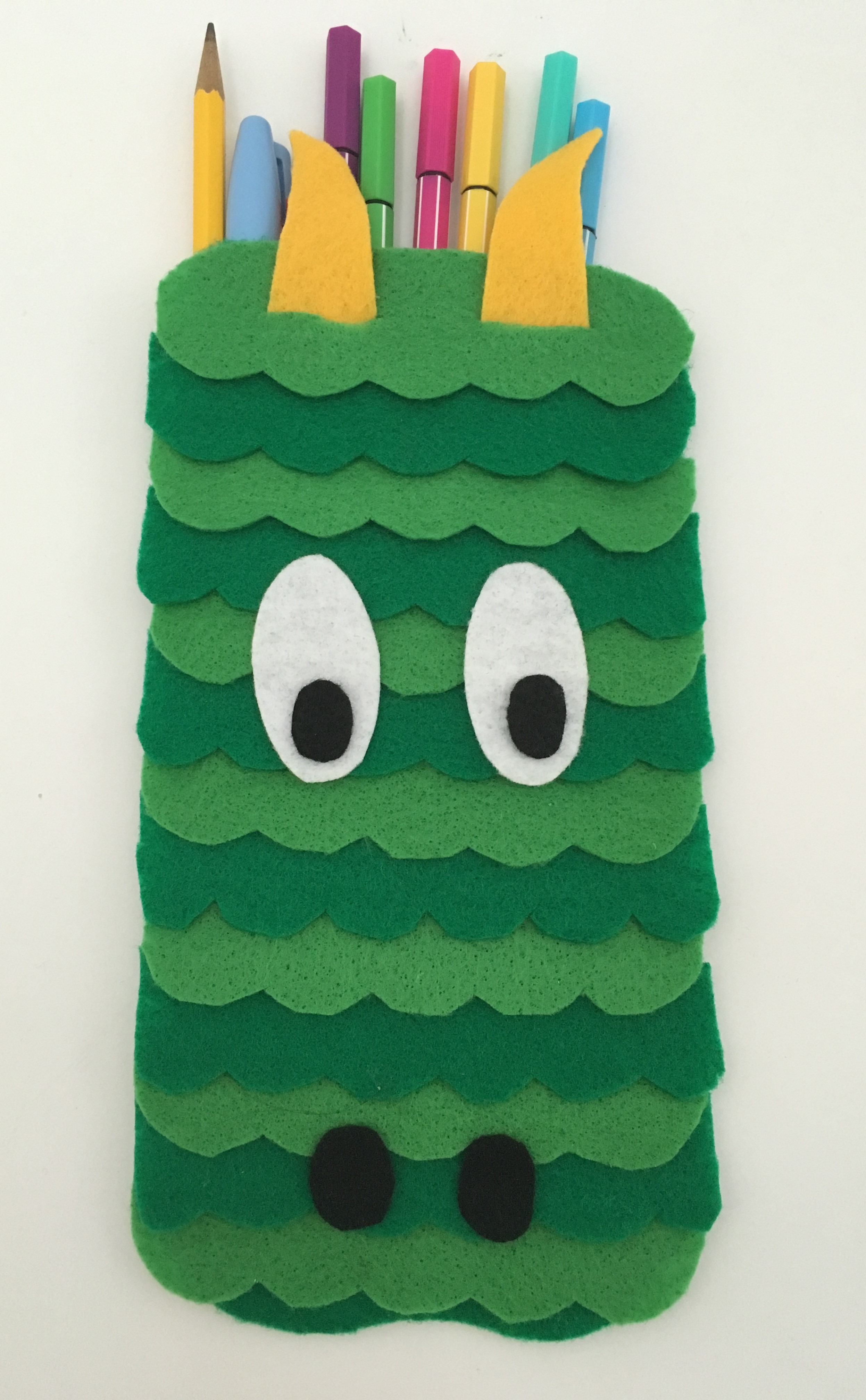 celebrate-picture-books-picture-book-review-dragon-pencil-case-front-eyes-down