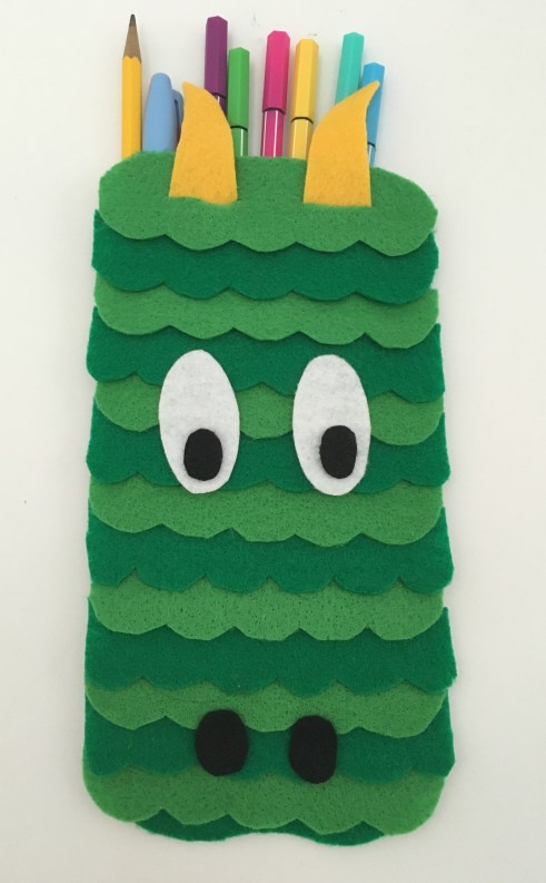 celebrate-picture-books-picture-book-review-dragon-pencil-case-front-eyes-down