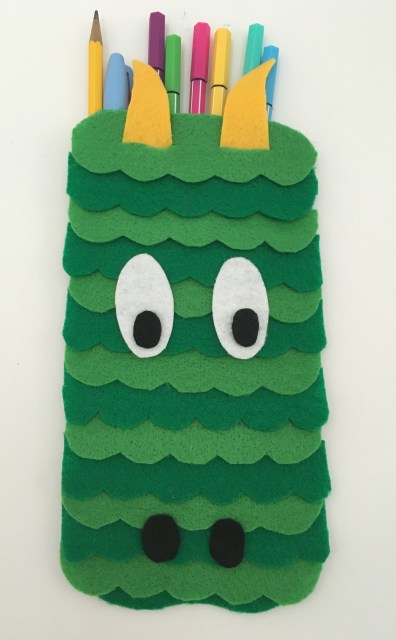 celebrate-picture-books-picture-book-review-dragon-pencil-case-front-eyes-down