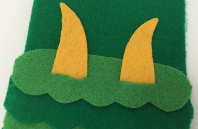 celebrate-picture-books-picture-book-review-dragon-pencil-case-top-of-head