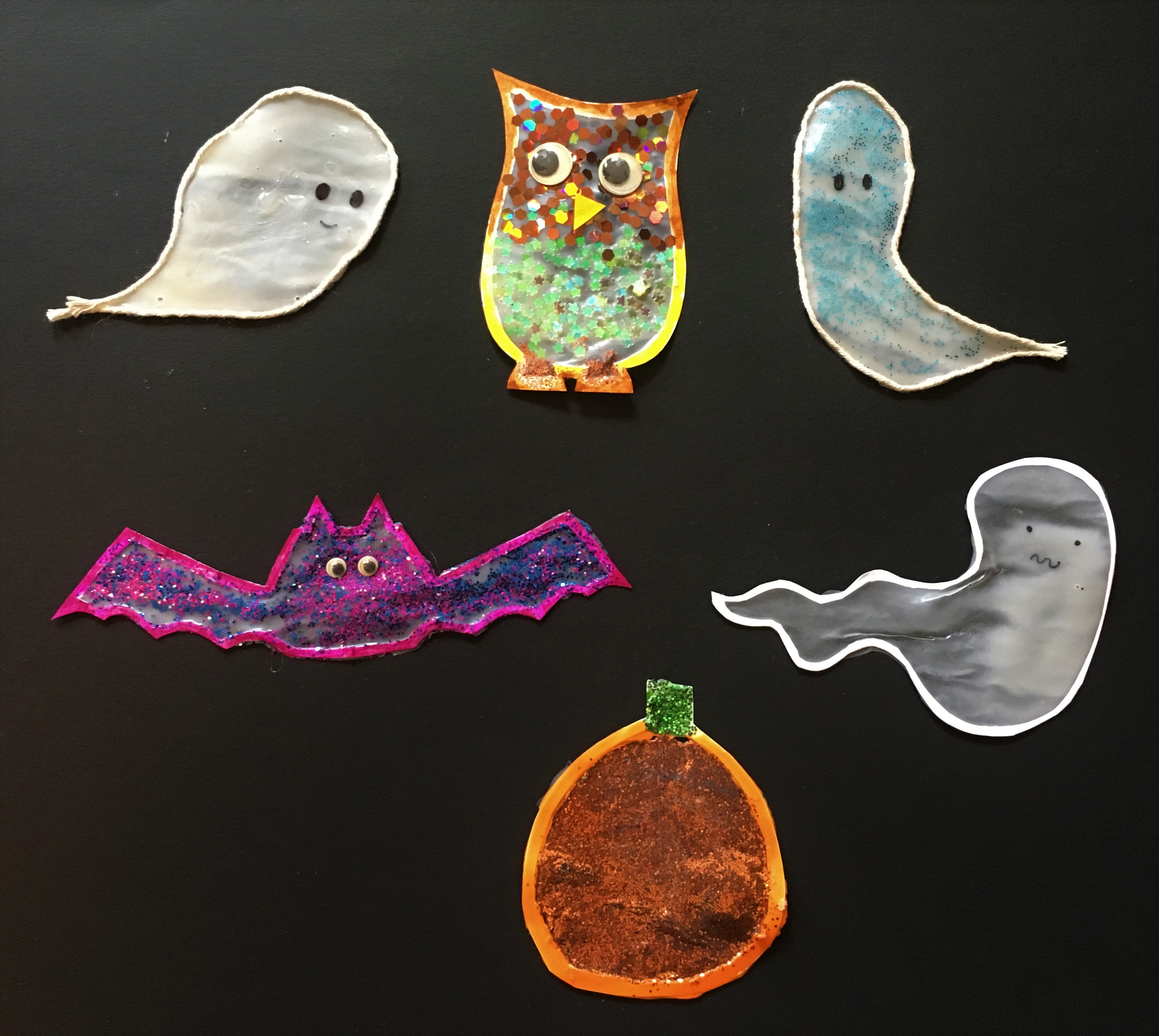 celebrate-picture-books-picture-book-review-halloween-hanging-figures-black-background